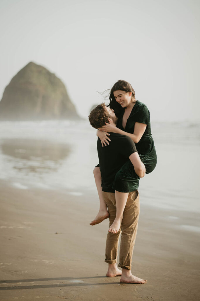 Couple engagement photos on the beach at Cannon Beach in Oregon