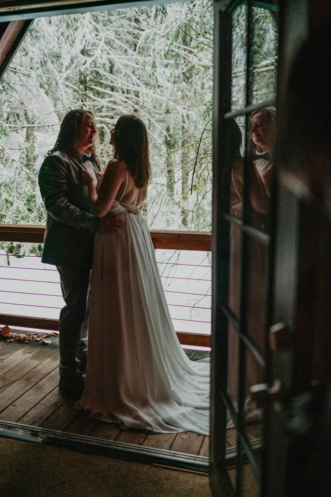 Couple portraits at dark moody wedding cabin in Oregon