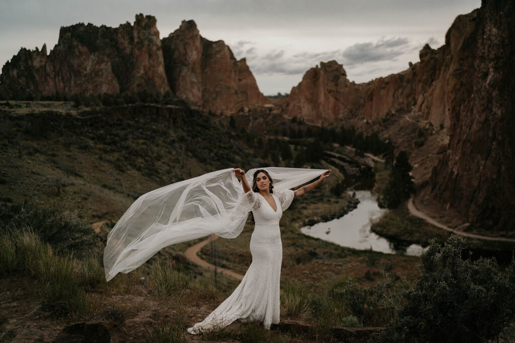 Bridal portraits at Smith Rock with long flowing veil