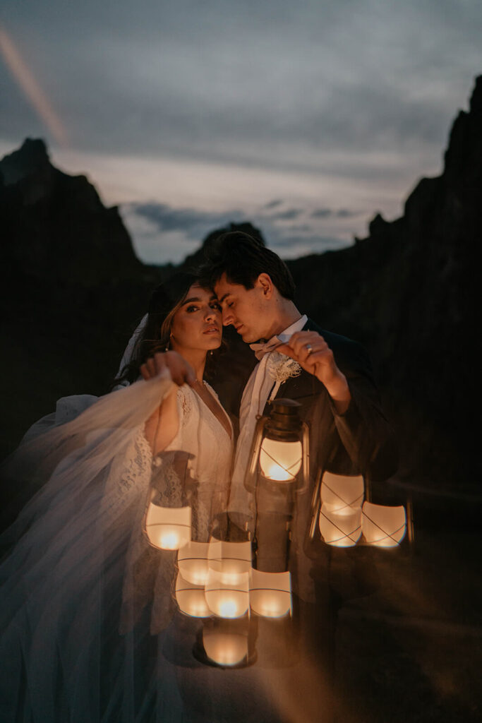 Bride and groom blue hour elopement portraits with lanterns at Smith Rock State Park