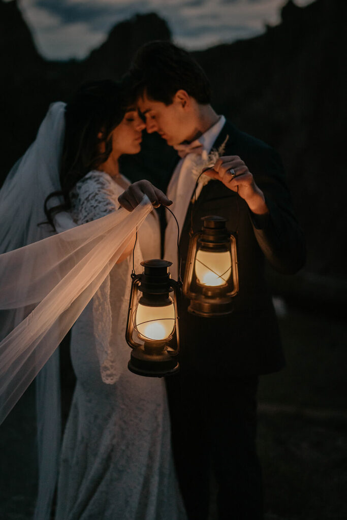 Bride and groom blue hour elopement portraits with lanterns at Smith Rock State Park