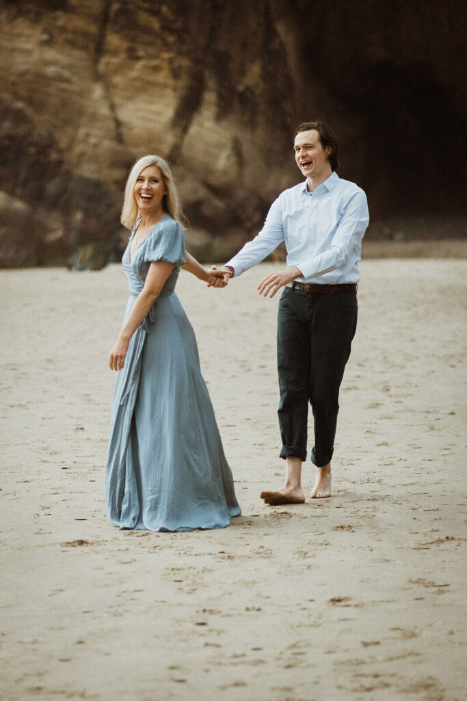 Couple dancing on the beach at Hug Point during engagement session