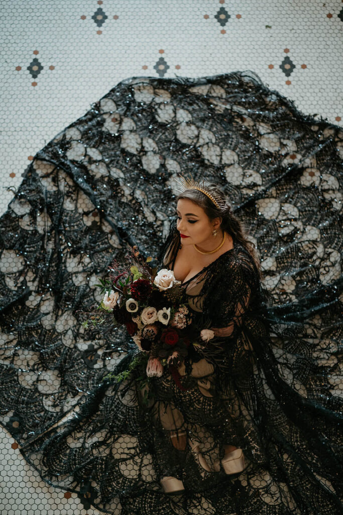Bride wearing black lace wedding dress at The Ruins at the Astor