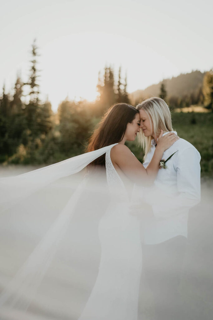 Two brides couple portraits during Sunrise, Mount Rainier elopement