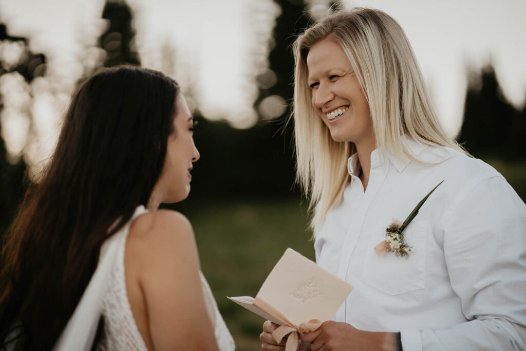 Two brides exchanging vows at Sunrise, Mount Rainier