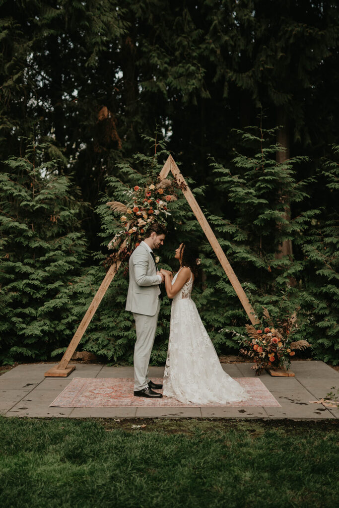 Outdoor wedding ceremony at CedarVale Events woodland themed wedding
