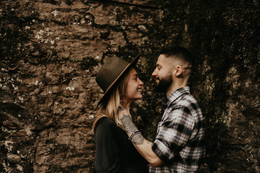 Couple smiling during adventure engagement session in Oregon
