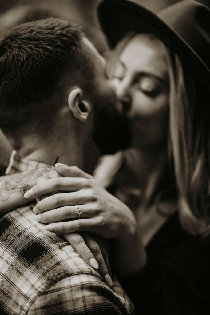 Couple kissing during engagement photoshoot at Latourell Falls