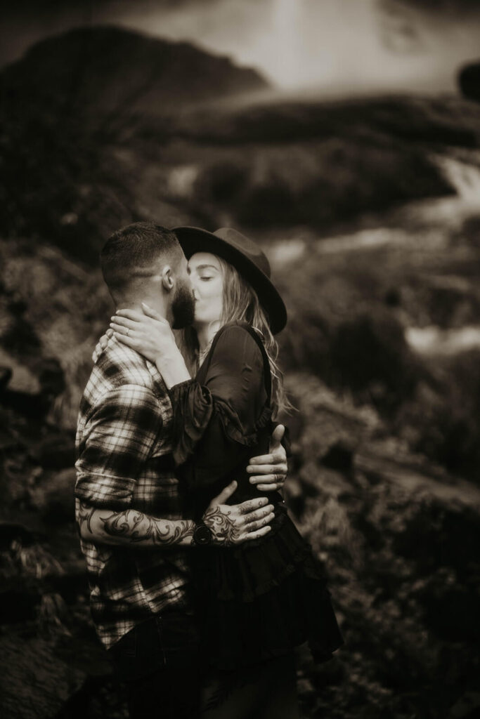 Couple kissing during winter engagement photos in Portland