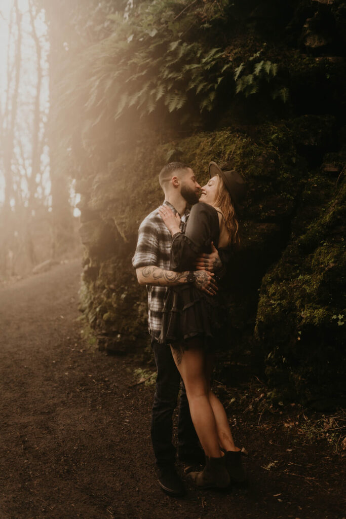 Couple kissing during Latourell Falls engagement session