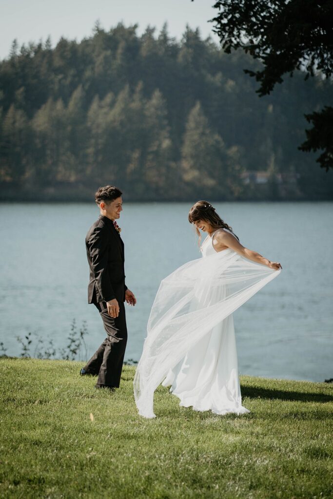 Bride twirling in her dress for groom during private first look at Cascade locks