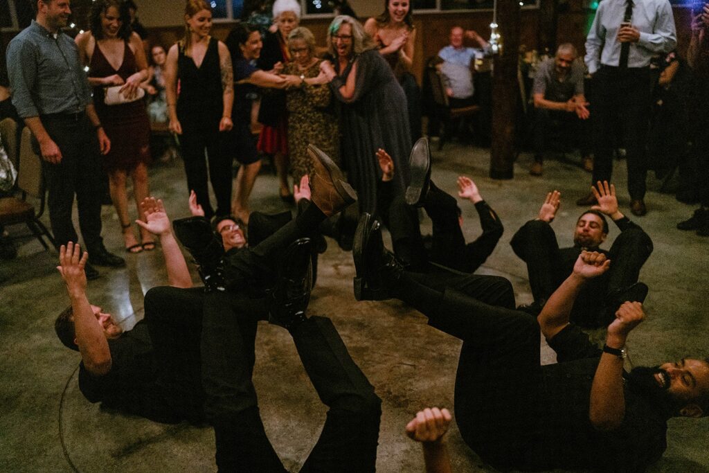 Groomsmen dancing on the floor at Cascade Locks wedding reception