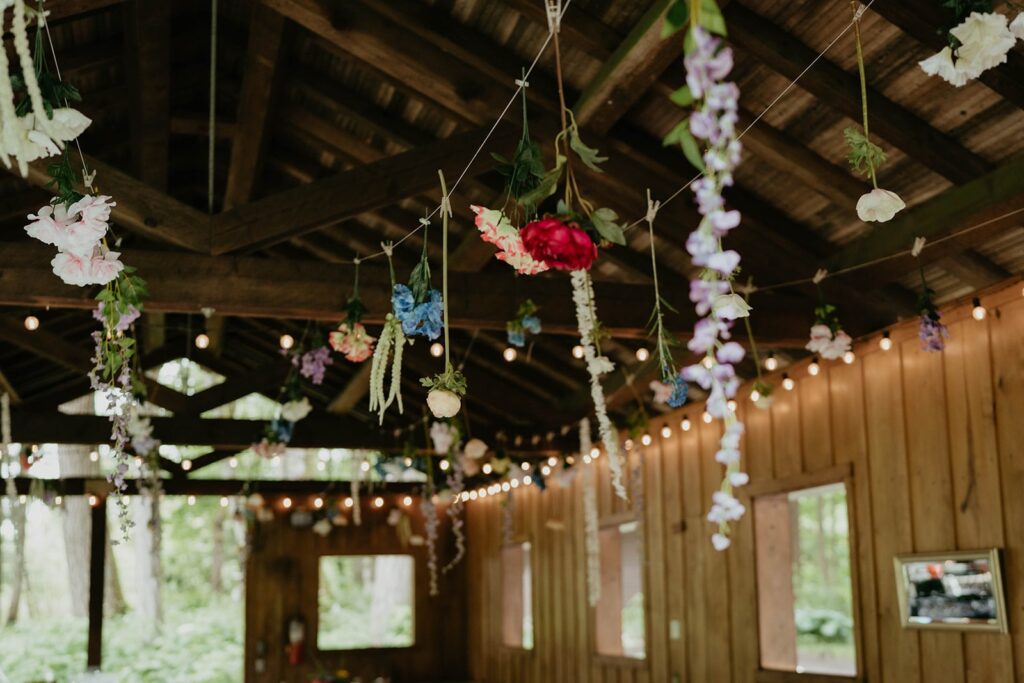 Colorful flowers hanging from the ceiling at Bridal Veil Lakes wedding