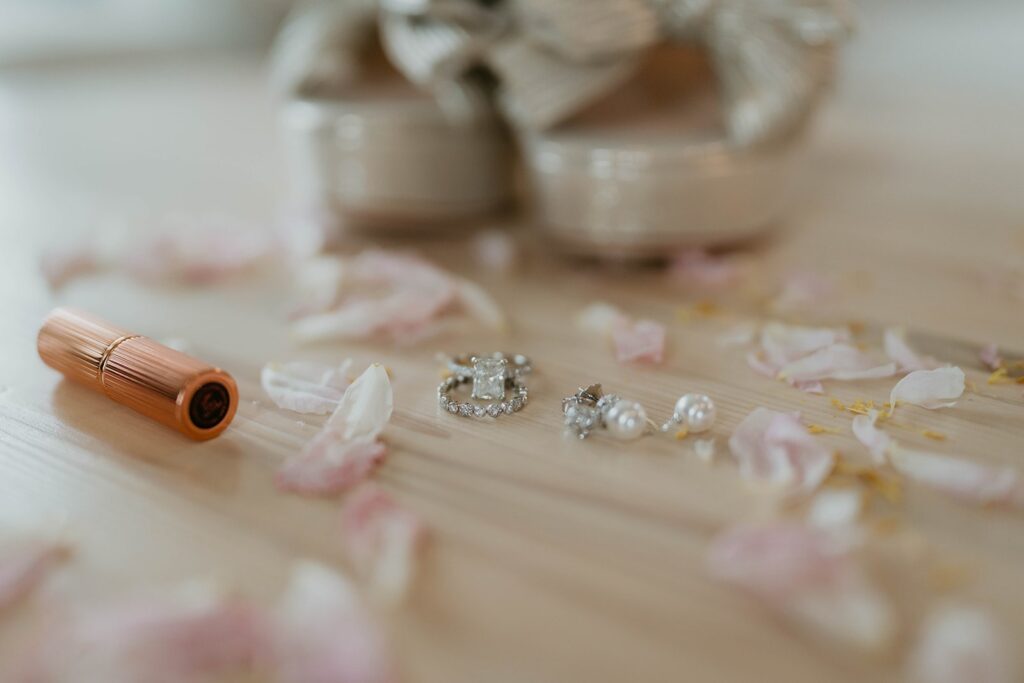 Diamond rings and pastel pink flower petals 