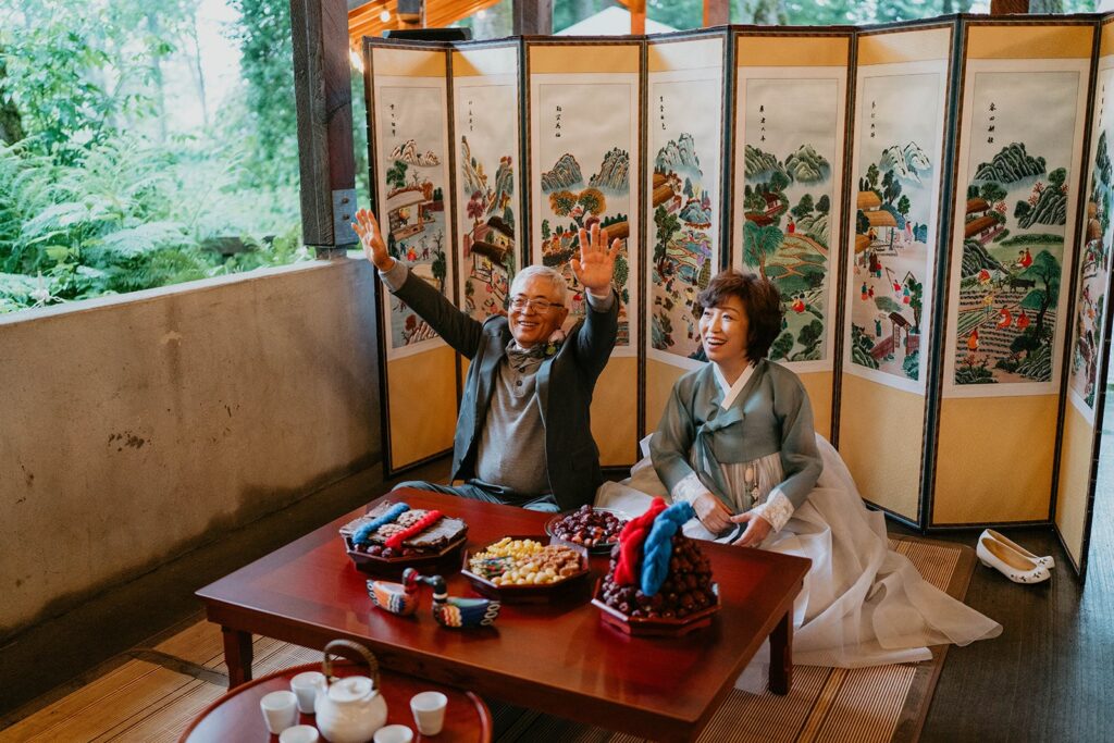 Parents of the couple throw chestnuts during traditional Korean wedding ceremony