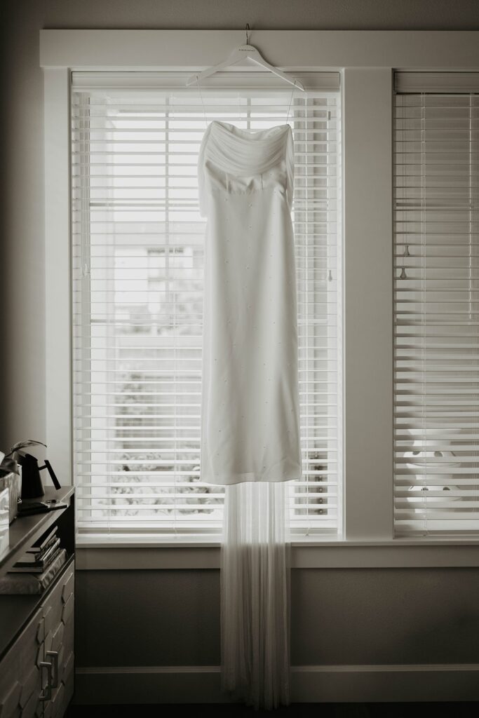 Modern Asian wedding dress hanging on the window