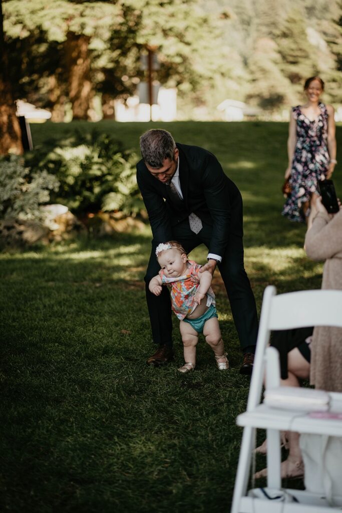 Bride and groom's baby walking down the aisle at Cascade Locks wedding