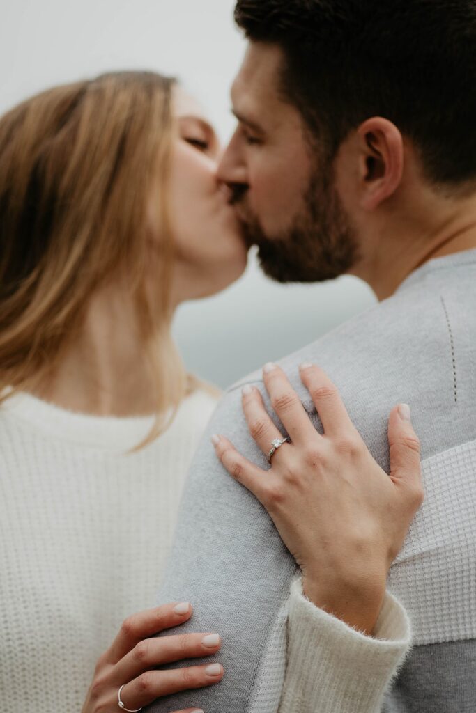Couple kissing during downtown Portland engagement photosession