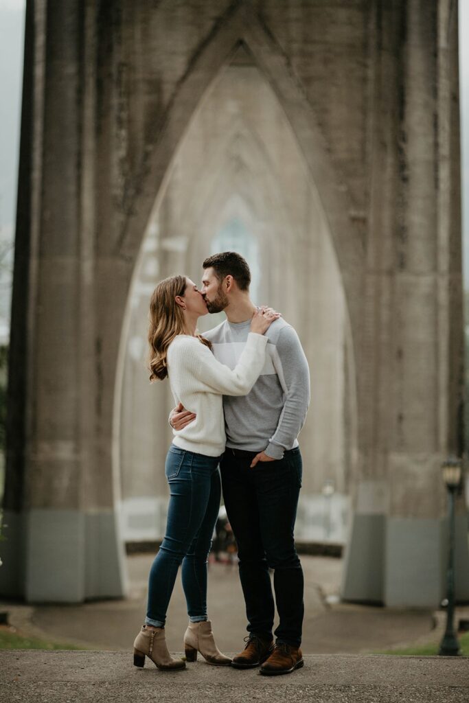 Couple kissing during fall engagement photos in Portland, Oregon