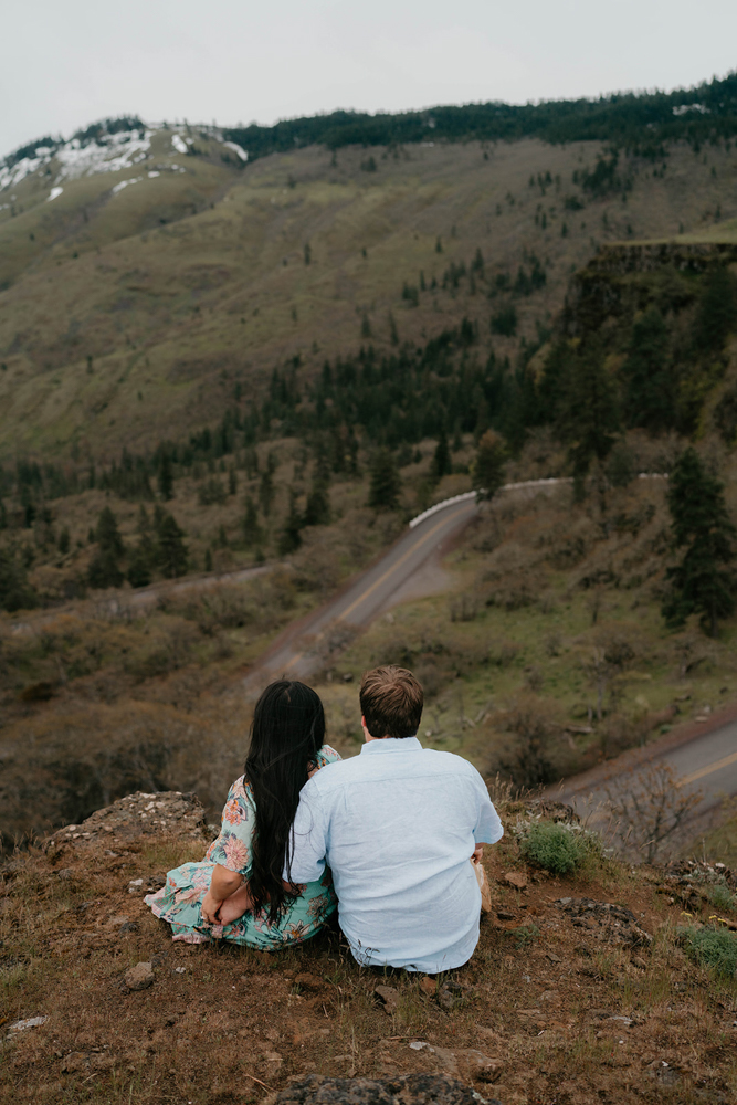 A couple sitting next to each other overlooking Rowena Crest.