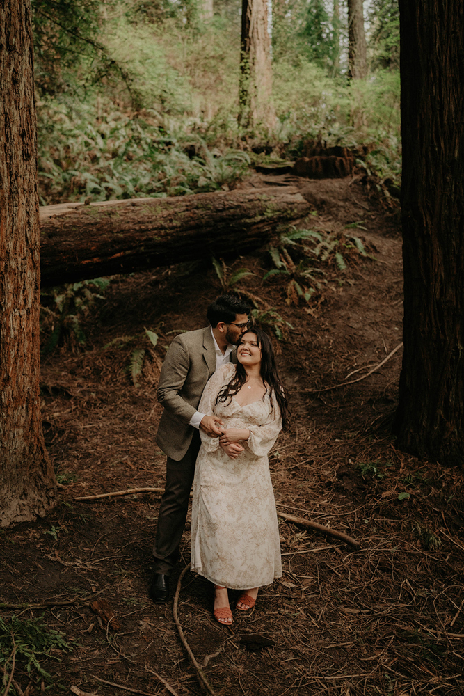 A couple posing for their engagement photos in Hoyt Arboretum