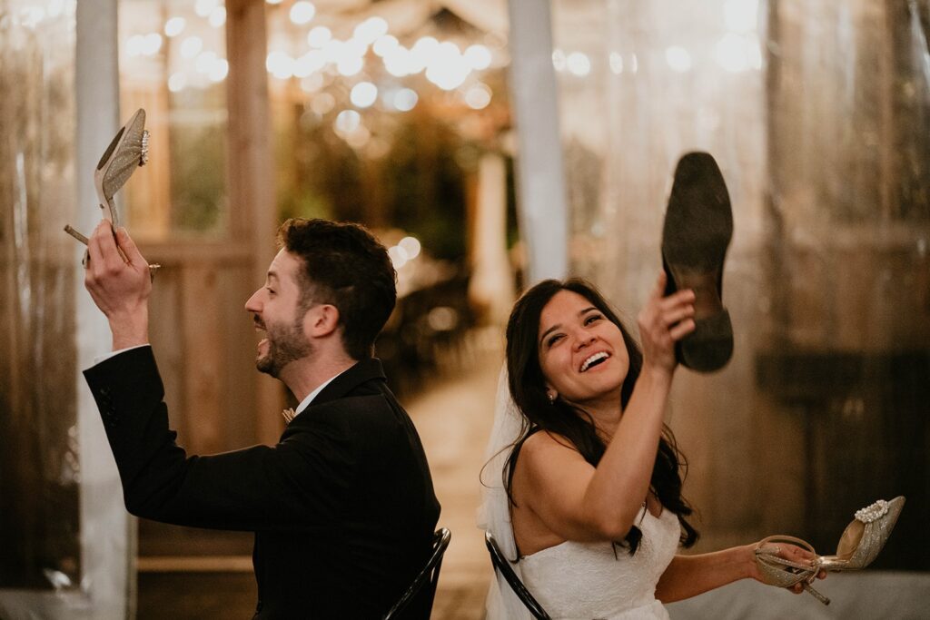 Bride and groom play the wedding shoe game during their Blockhouse Portland wedding