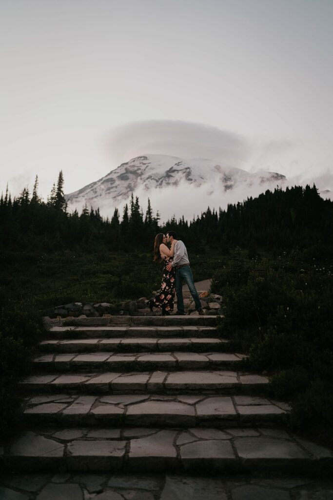 Couple kissing on the steps during Mt Rainier engagement photos