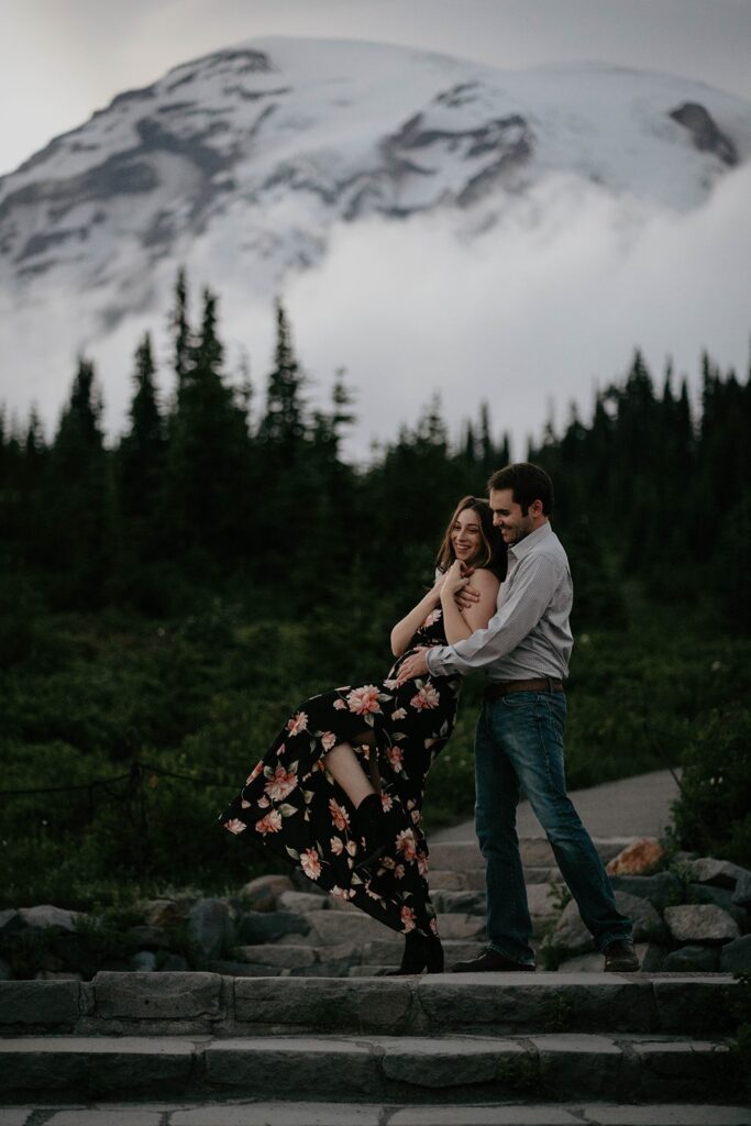 Couple dancing on the steps at Paradise during Mt Rainier engagement photos