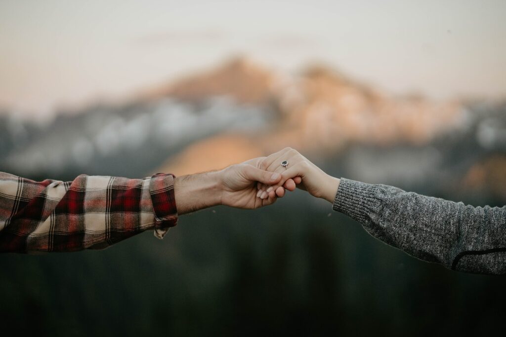 Couple holding hands at Mt Rainier engagement session 