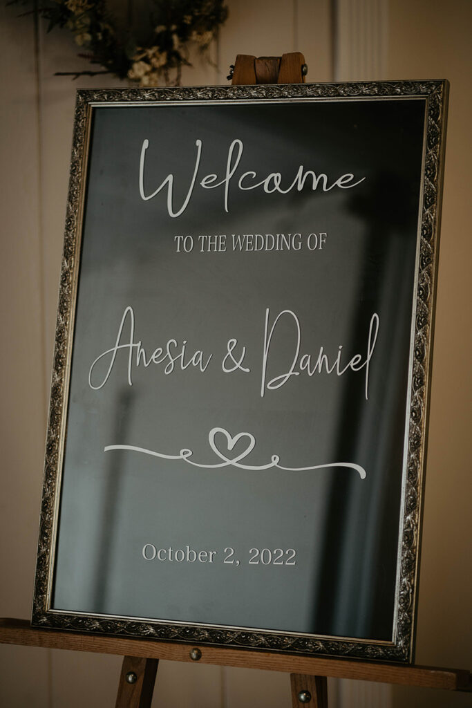 A sign welcoming guests to Anesia and Daniel's wedding. 