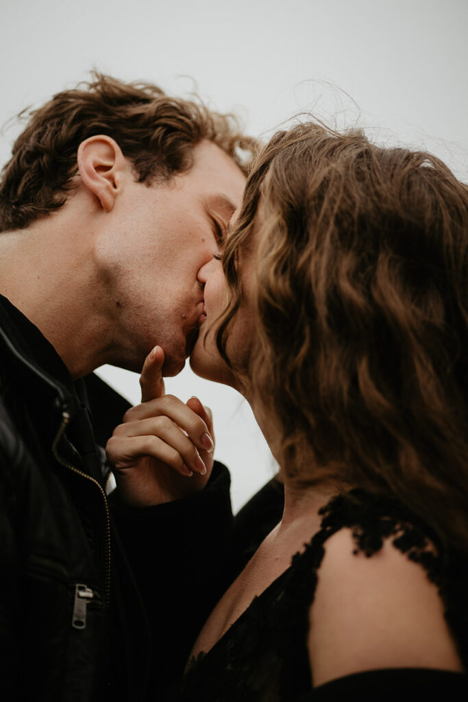 A close up of a couple kissing. 