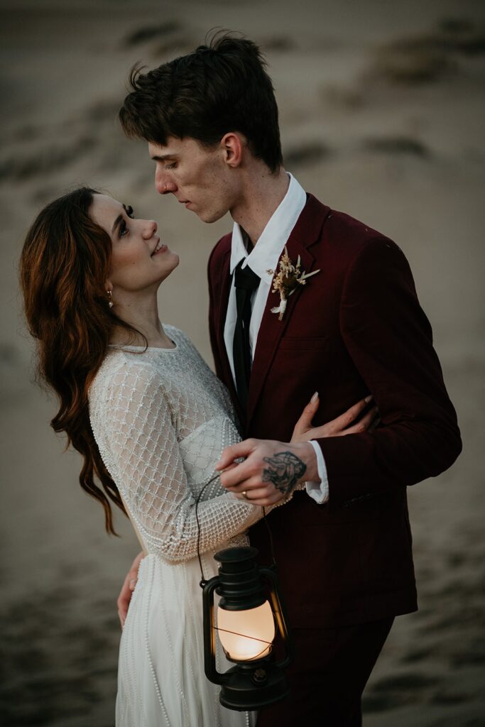 Bride and groom blue hour elopement photos on the sand dunes in Oregon