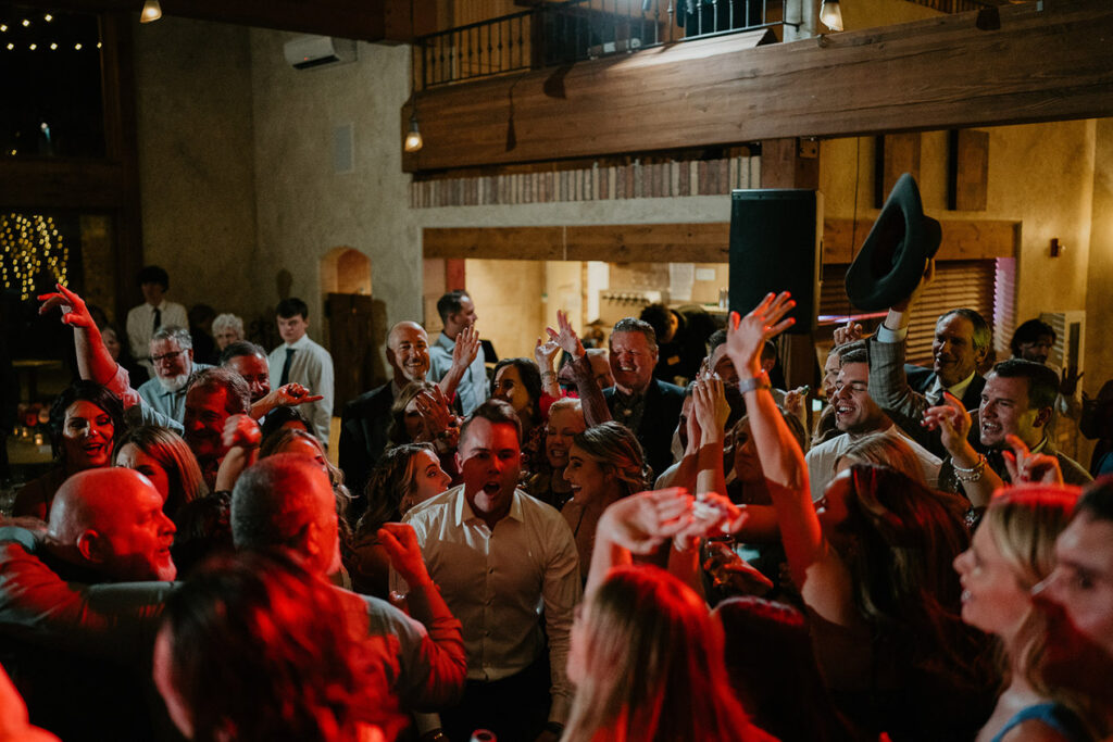Wedding guests partying and dancing  in Estes Park. 