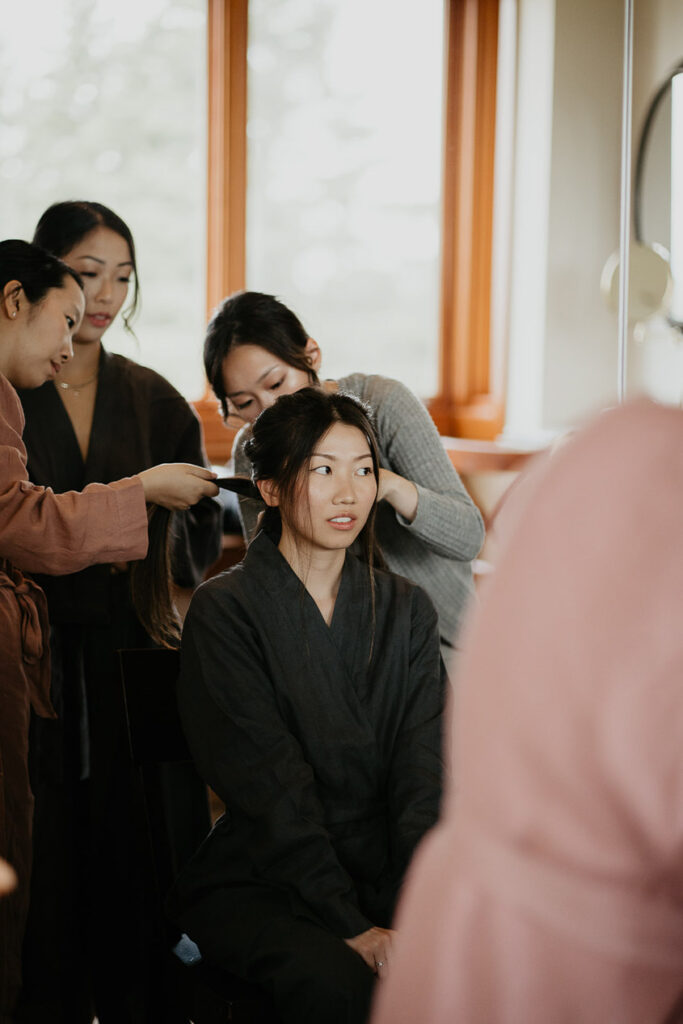 Judith getting her hair and makeup done before her wedding. 