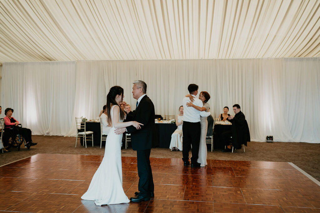 Judith dancing with her father during their reception. 