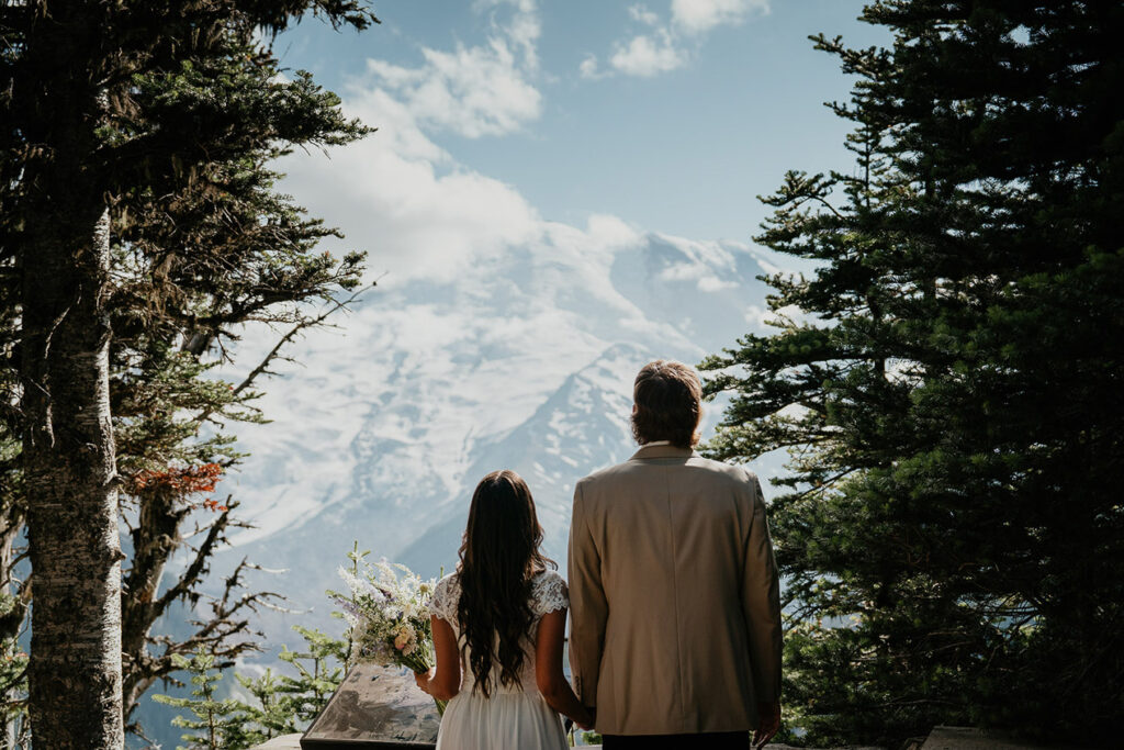 The couple looking out at the view of Mt Rainier. 
