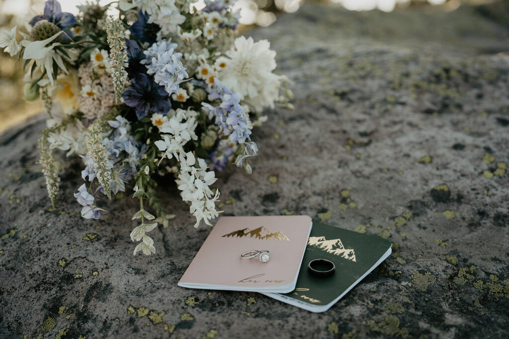 The couple's rings and bouquet of flowers. 