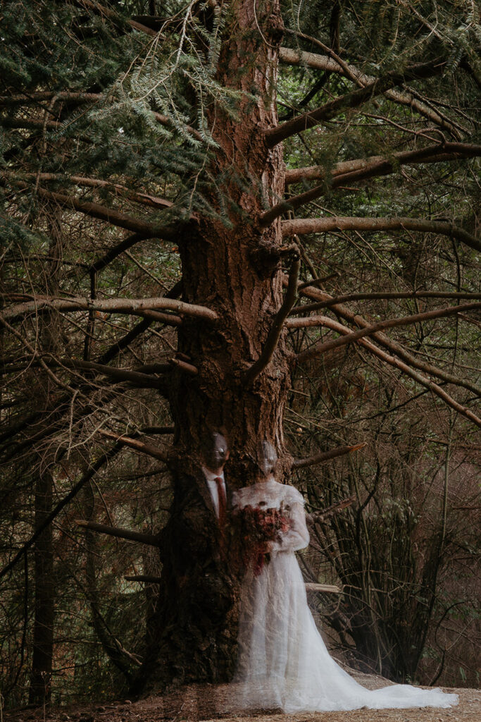A double exposure of a couple wearing masks appearing as ghosts in a forest. 