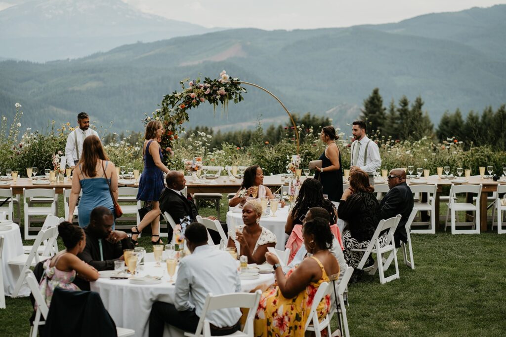 Guests mingle during cocktail hour at Gorge Crest Vineyards wedding reception