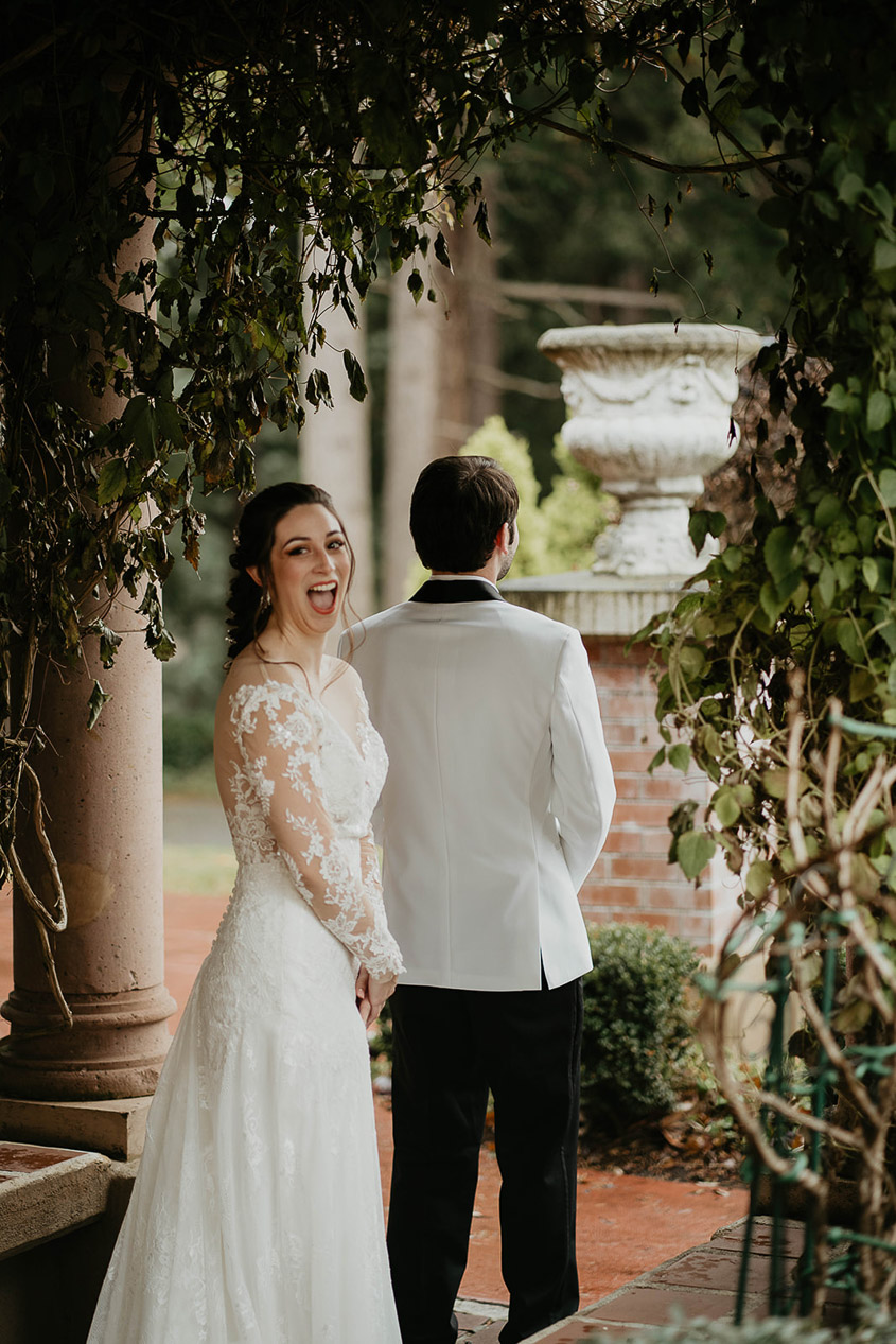 The bride smiling right before her first look with her groom at Lairmont Manor. 