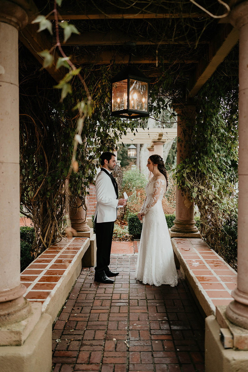 The bride and groom standing in a courtyard at Lairmont Manor. 
