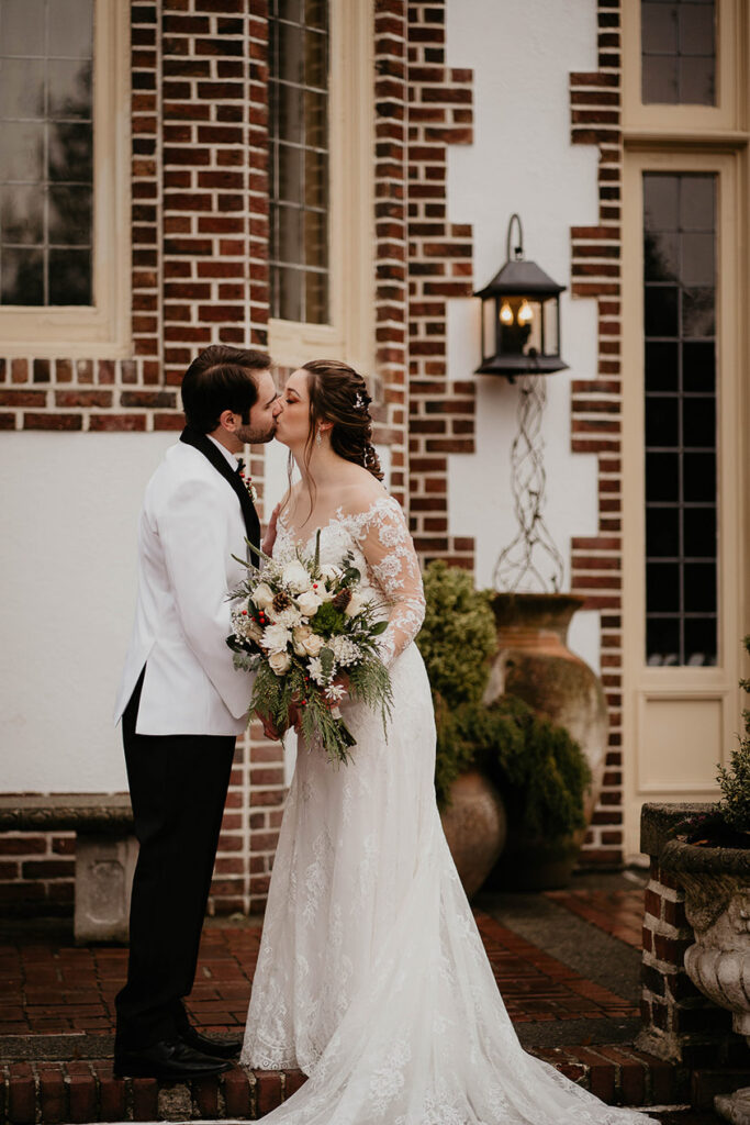 The bride and groom kissing at Lairmont Manor. 