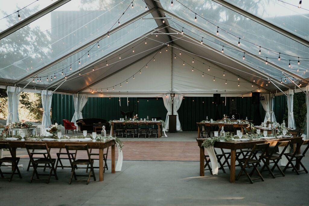 Reception setup under a string like canopy at the Griffin House wedding venue