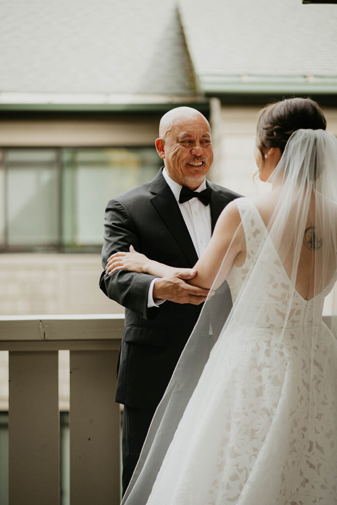 the bride and her father sharing an intimate moment. 