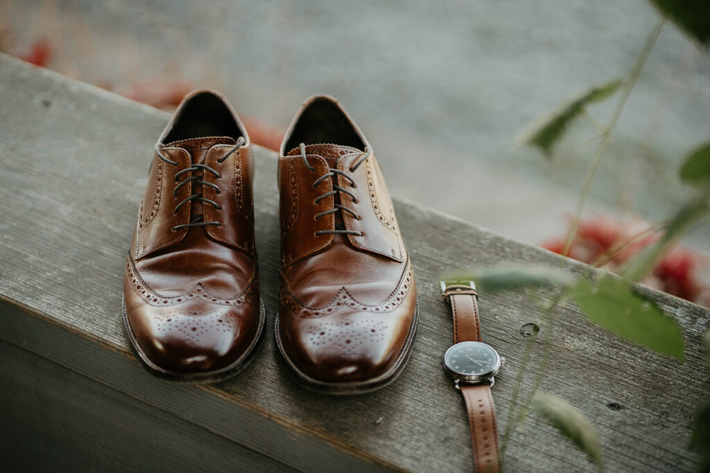 The groom's dress shoes and watch. 