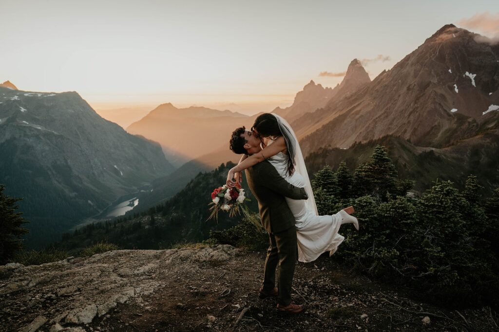 Bride and Groom kiss on a mountain in the North Cascades during their elopement in Washington