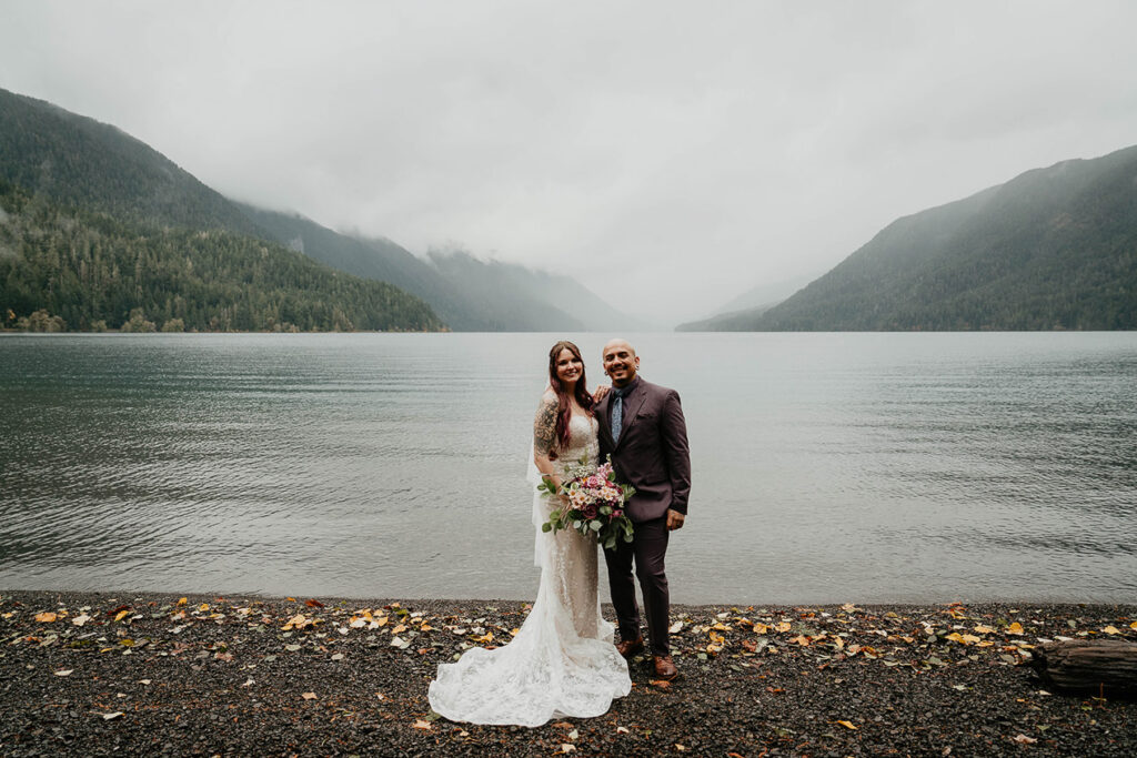 The bride and groom posing with Lake Crescent in the background. 