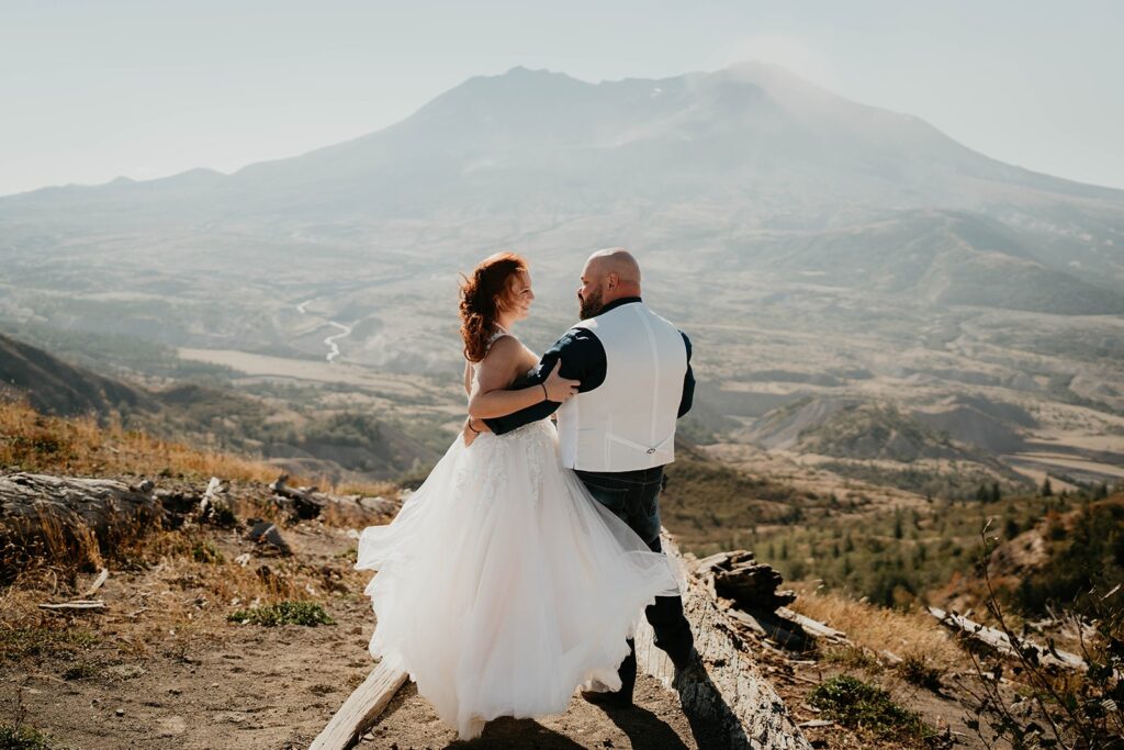 Bride and groom hug during their Mt St Helens elopement in the PNW