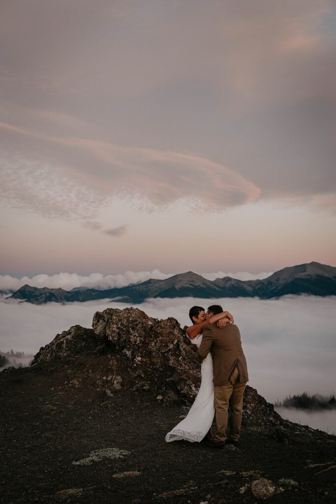 Bride and groom kiss at Hurricane Ridge while eloping in the PNW