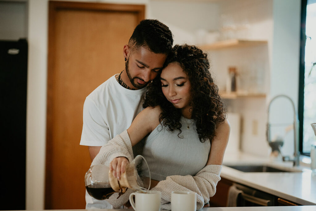 the bride and groom making coffee together at the Woodlands house venue. 